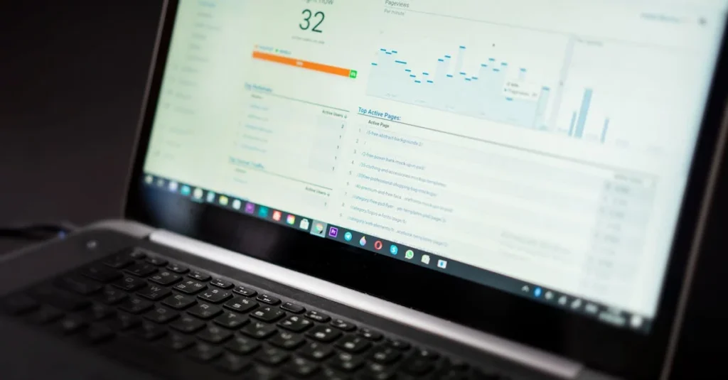 Laptop displaying analytics dashboard with conversion metrics and performance charts.