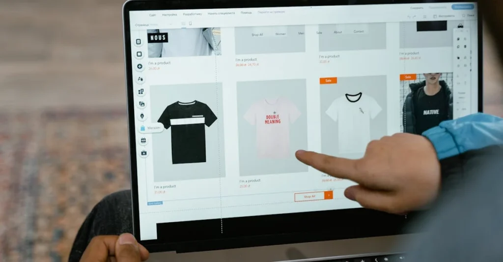 Close-up of a laptop displaying an eCommerce clothing website builder with product listings and sale items.