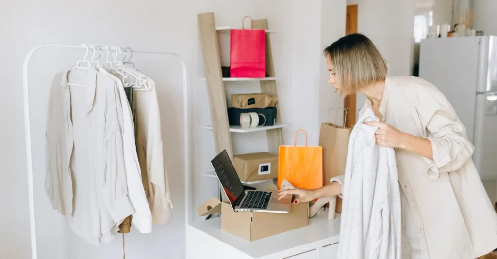 Woman organizing colorful shopping bags and clothing with intelligent search technology for efficient home inventory.