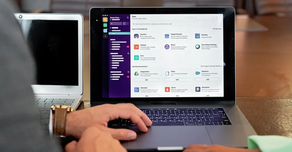 Person using laptop displaying Nosto reviews and unified platform dashboard with app integrations and team collaboration.