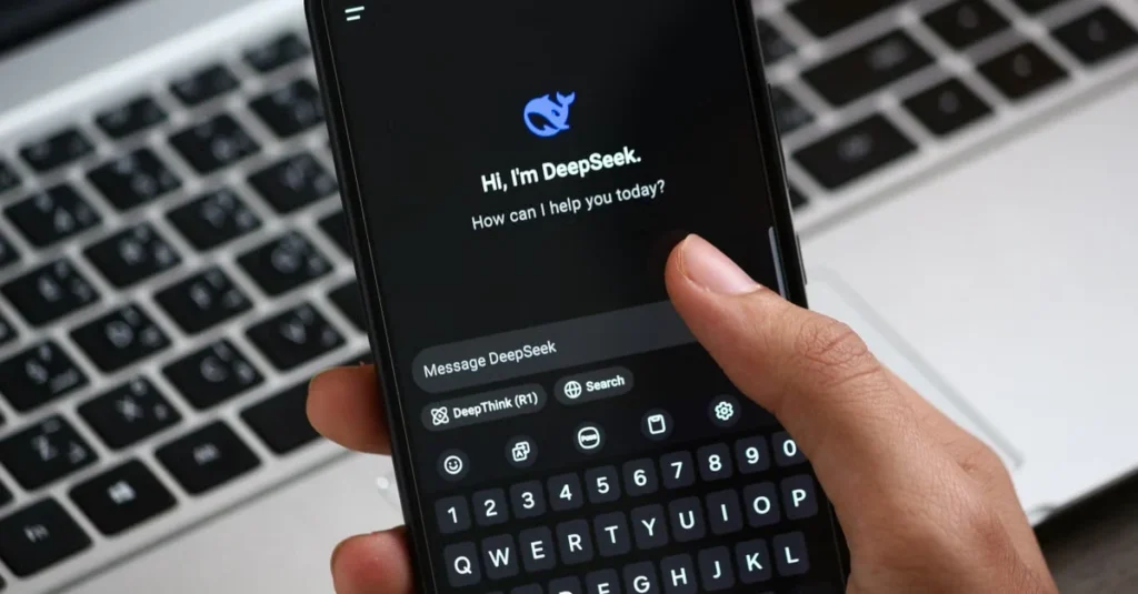Hand holding smartphone displaying AI chatbot for ecommerce product discovery assistance on dark interface.