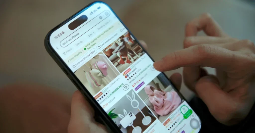 Person scrolling through ecommerce search results on smartphone displaying product listings and images.